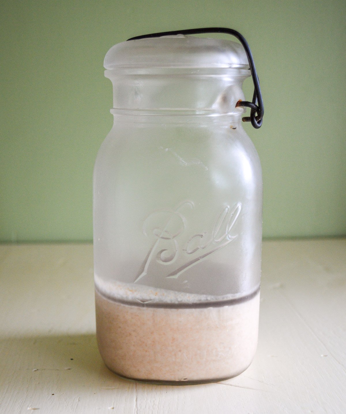 refrigerated sourdough starter with dark hooch on top