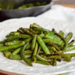 garlic green beans piled on a plate
