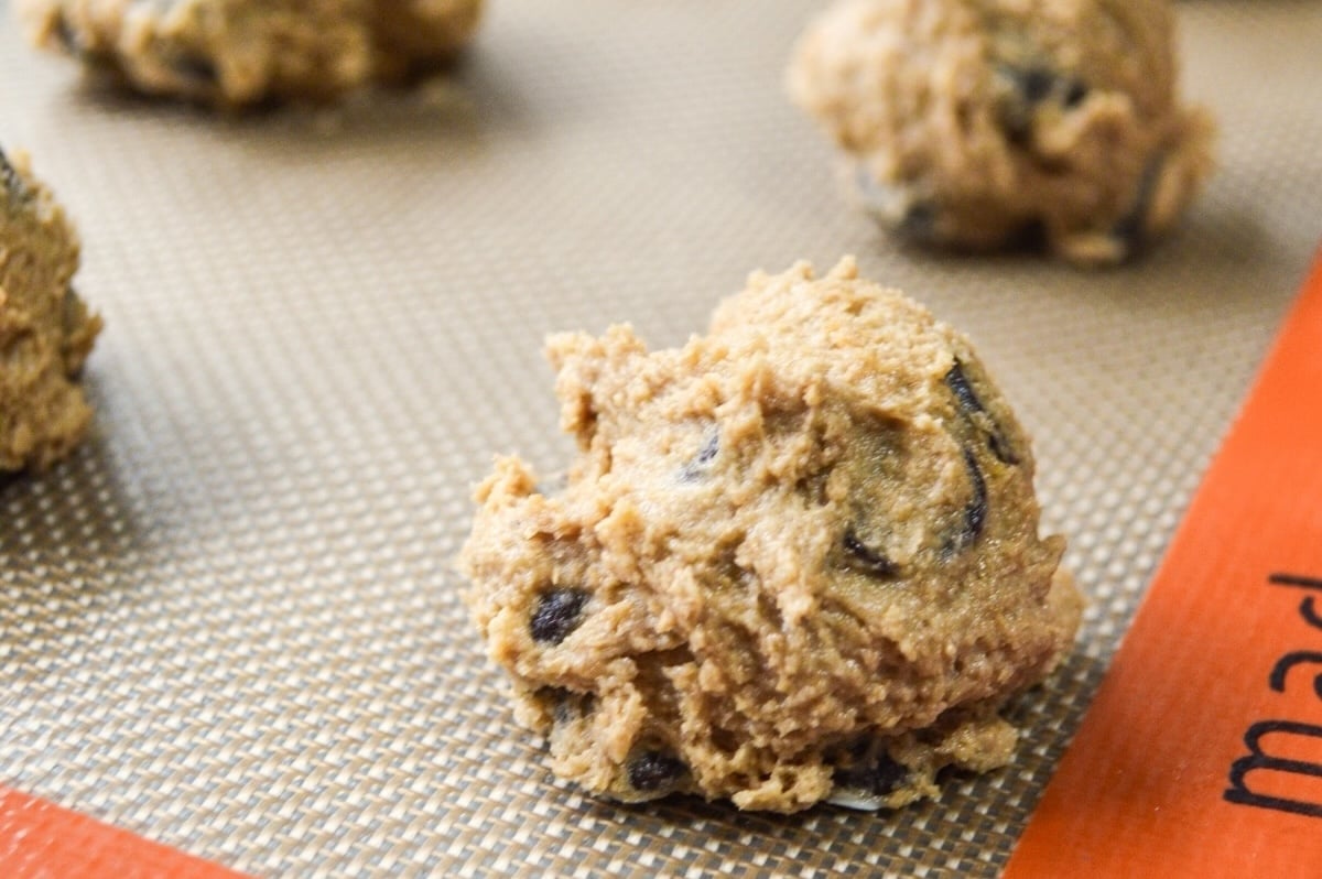 cookie dough ball on baking sheet