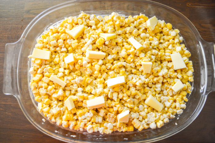 butter dotted on top of corn mixture