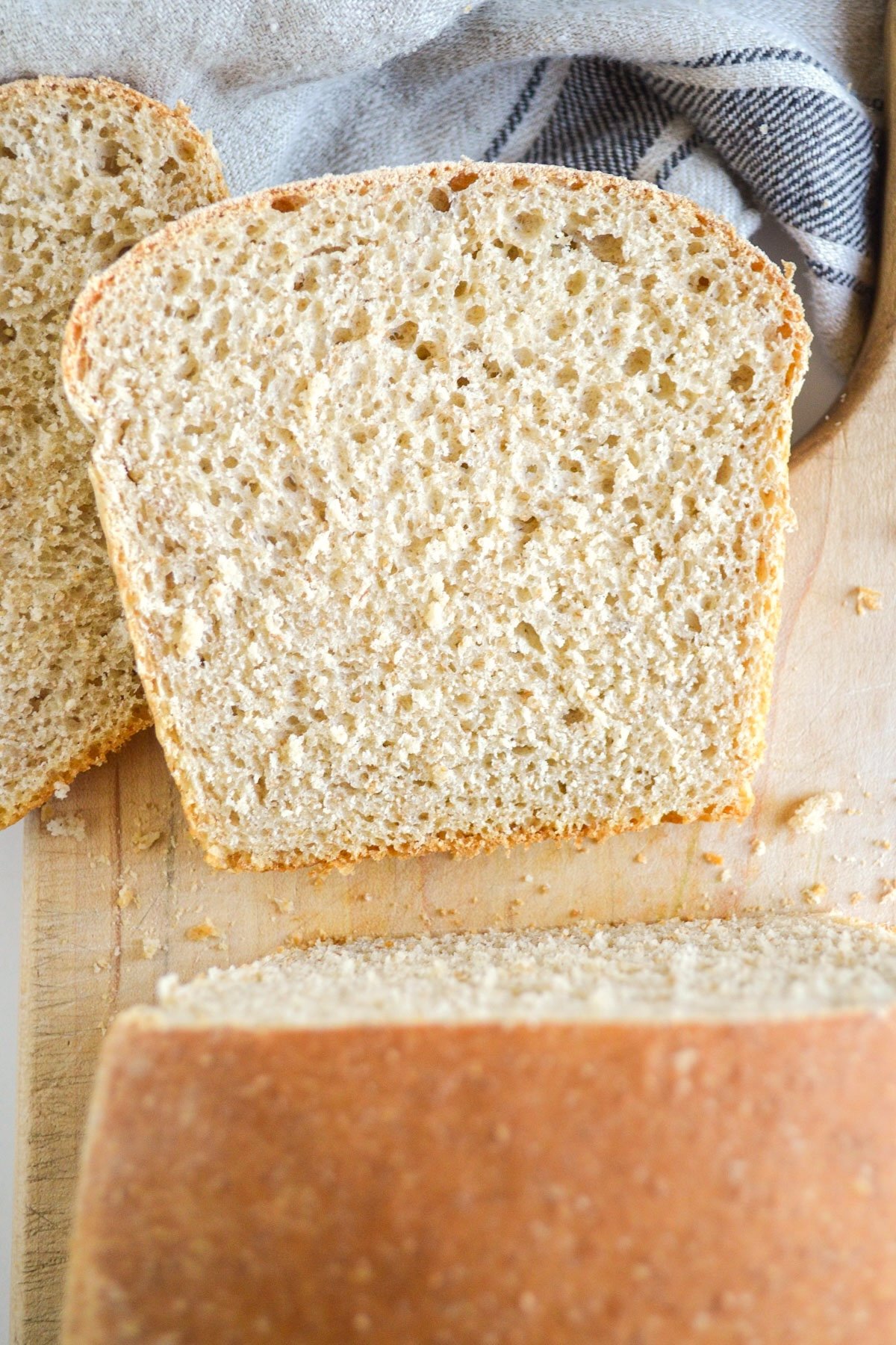 sliced sourdough sandwich bread on cutting board