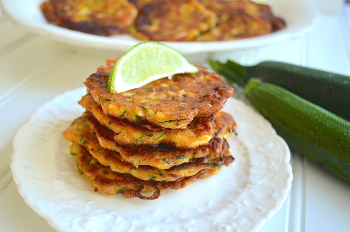 stack of zucchini fritters with feta and lime