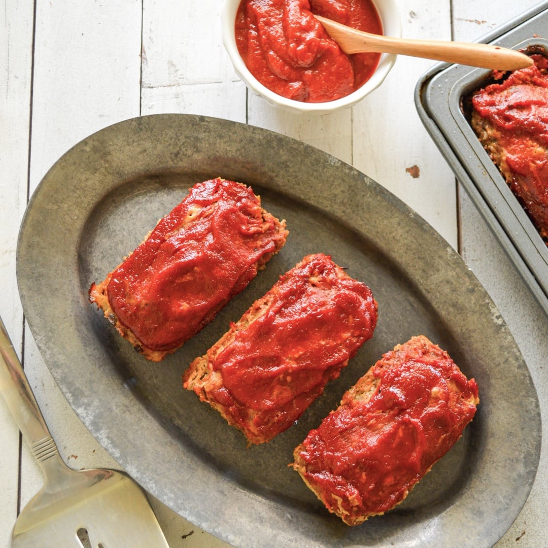 mini meatloaves with BBQ sauce on metal platter