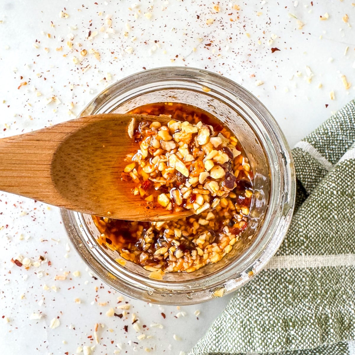 chili crisp on wooden spoon