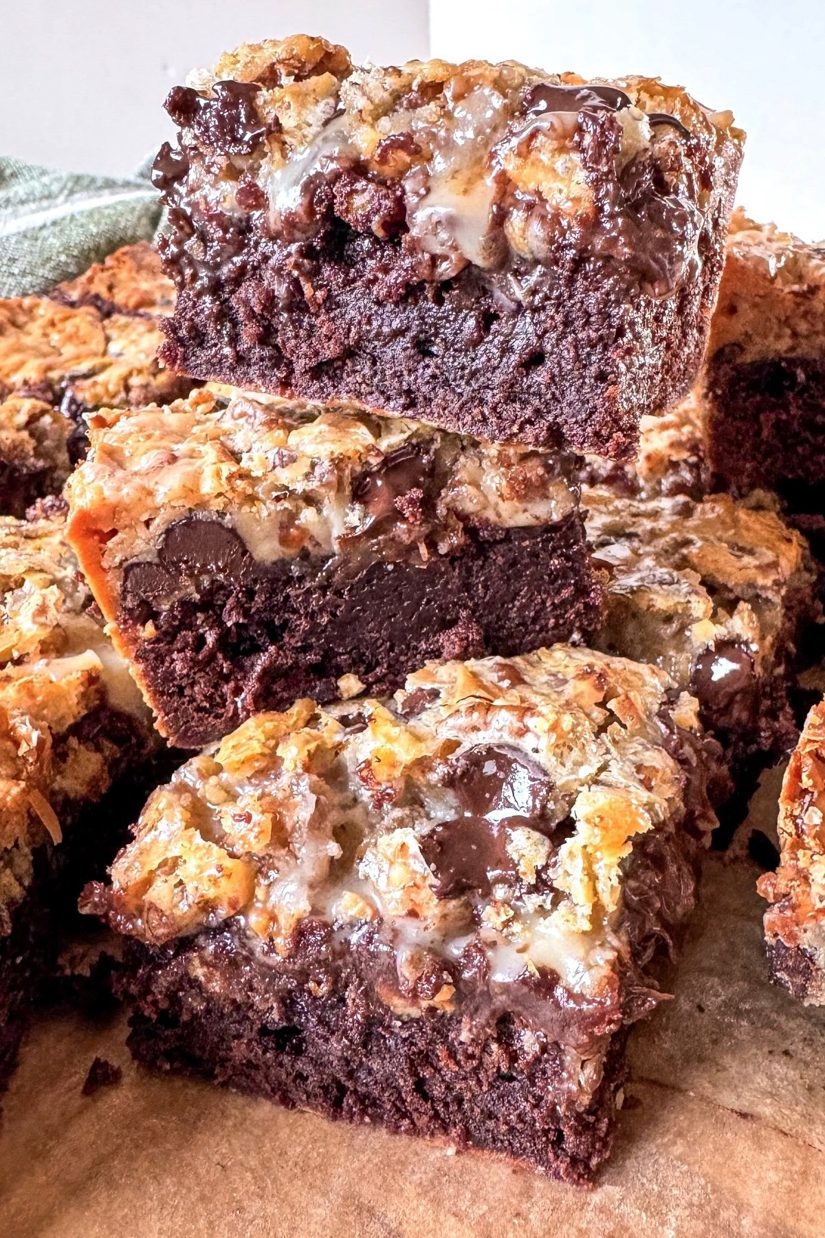 7 layer bars with brownie base stacked 3 high
