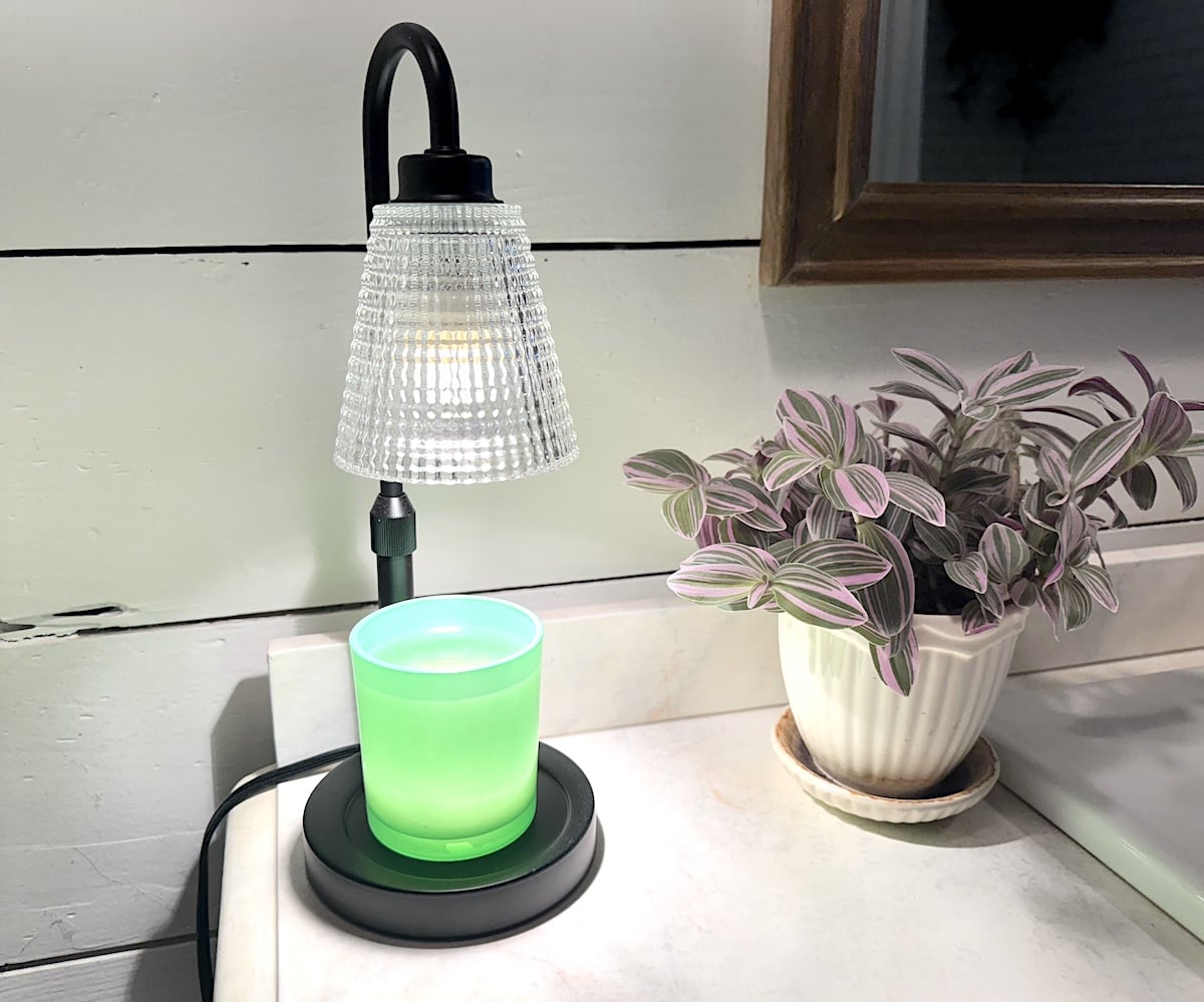 small black candle warmer turned on