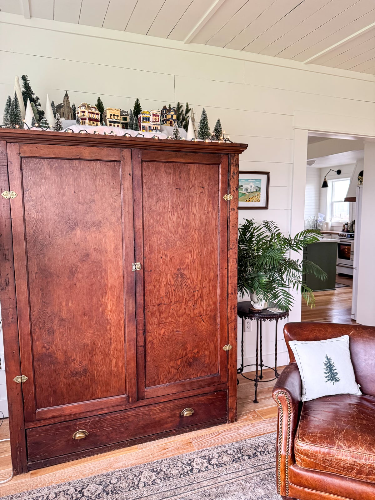 TV cabinet with Christmas village on top