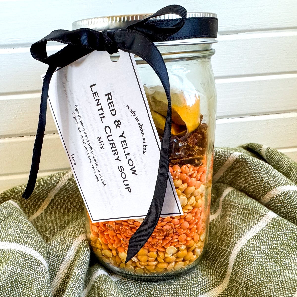 lentil curry soup in a jar with label and ribbon