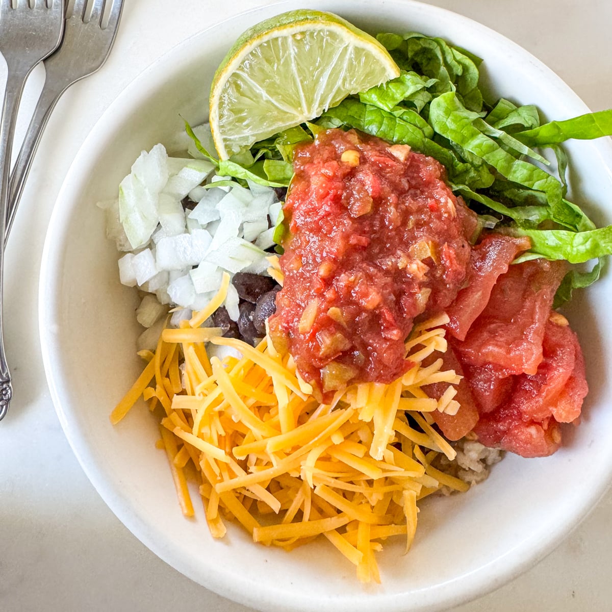 taco rice bowl assembled with toppings