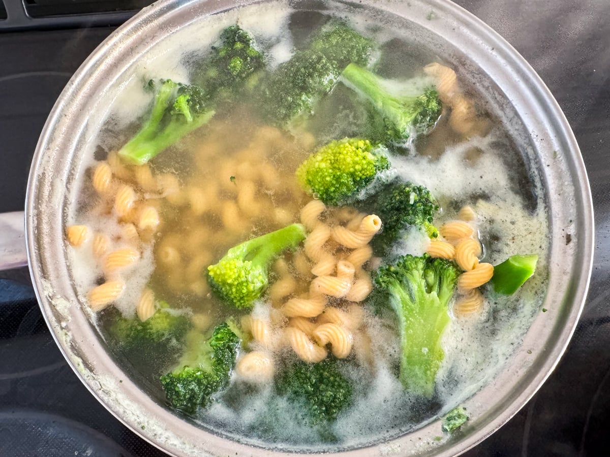 boiling pasta and vegetables for tuna pasta