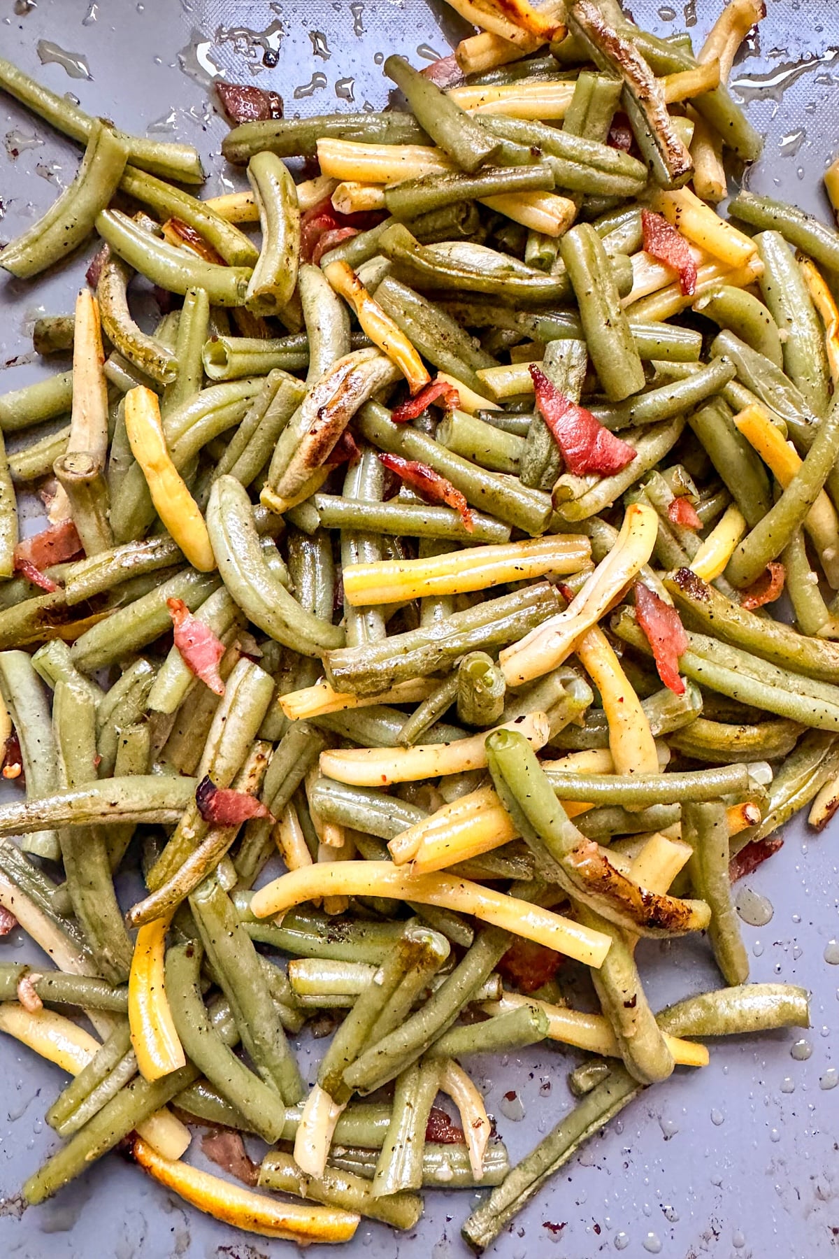 roasted green beans with bacon on baking pan