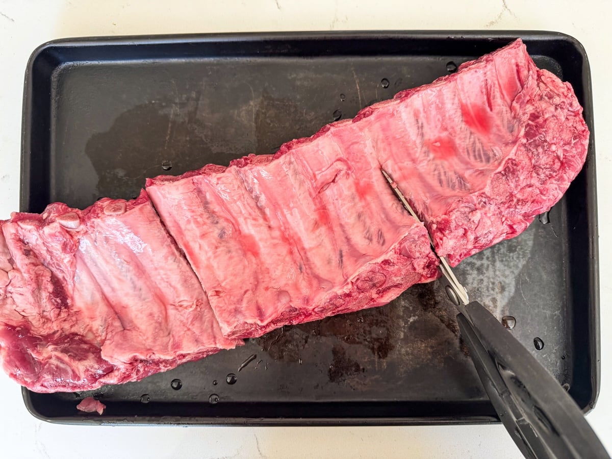 cutting rack of pork ribs