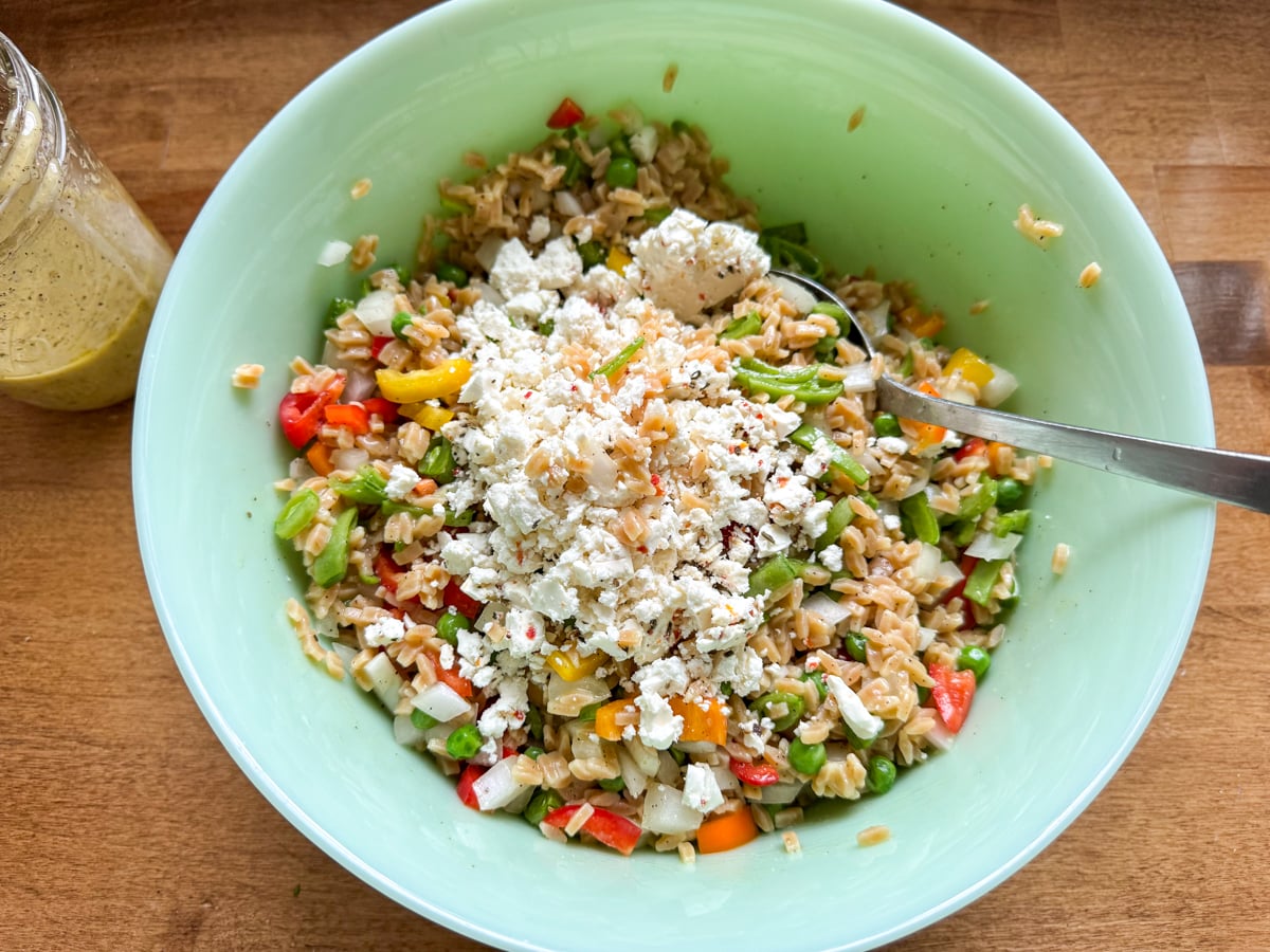 tossing salad with feta