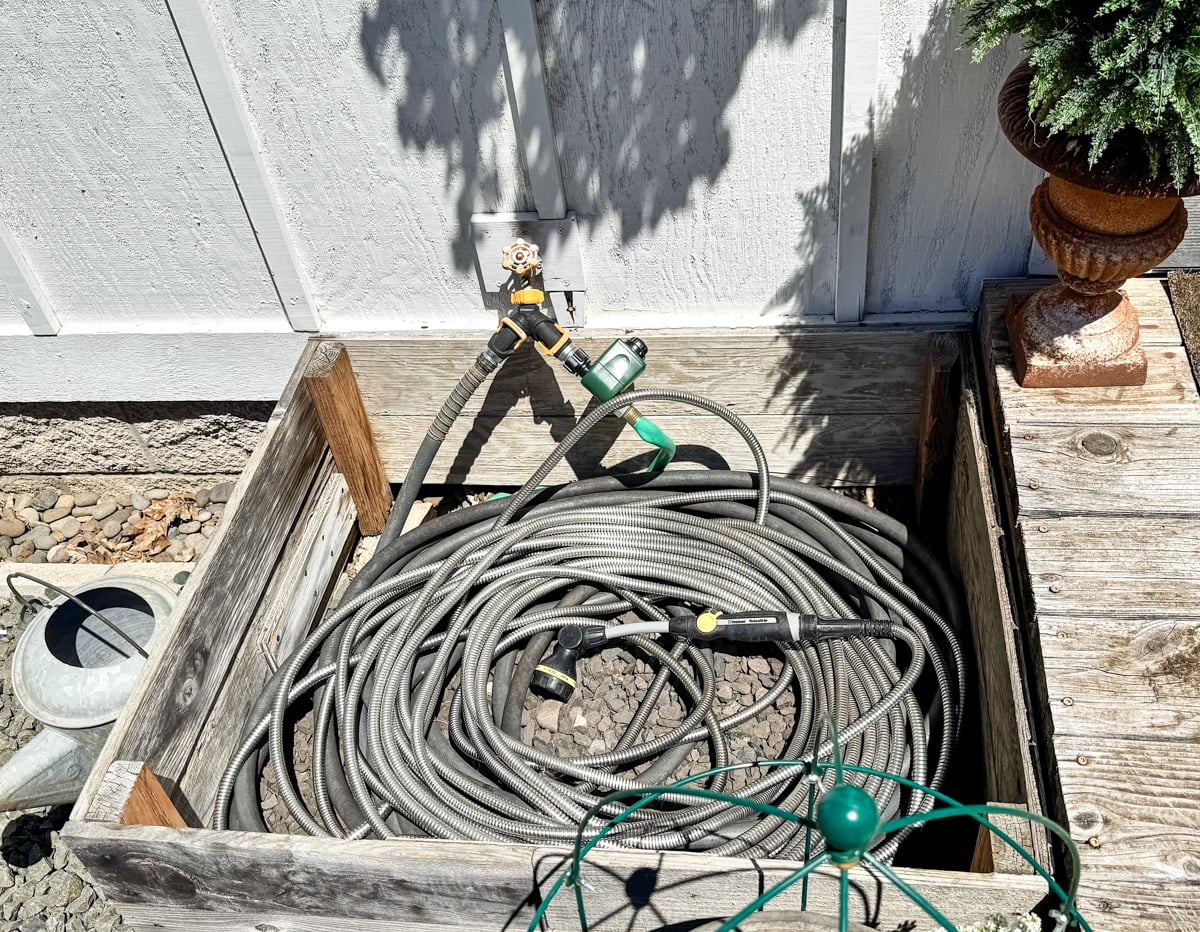 stainless steel hose curled up in hose box