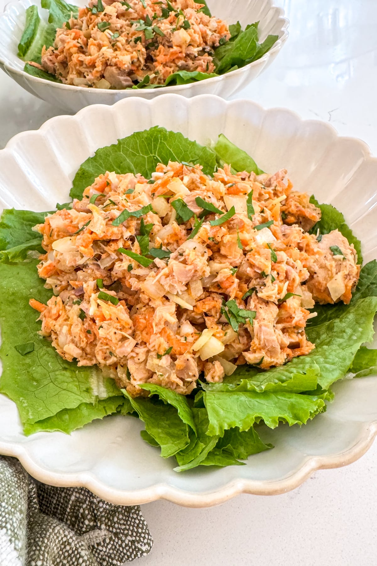 loaded tuna salad recipe on lettuce in bowl