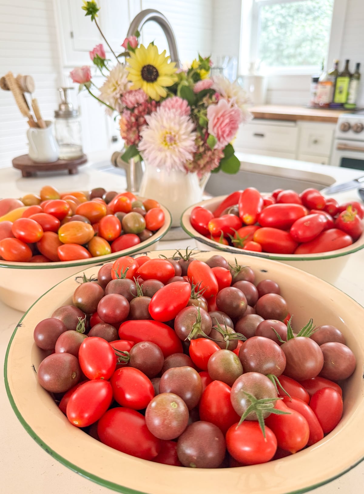enamel bowls of small tomatoes 