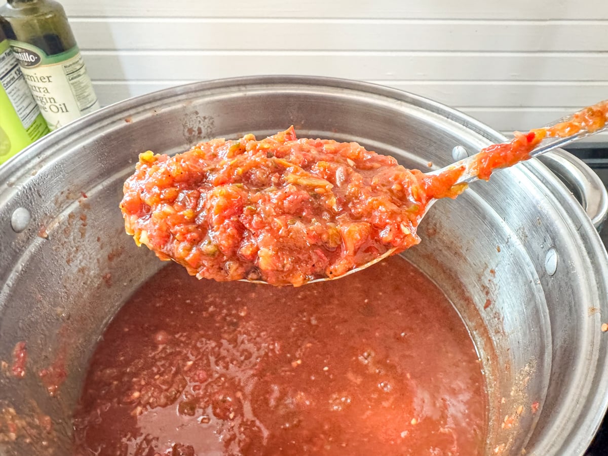spoon of cooked down salsa