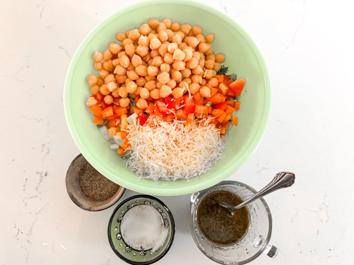chopped salad ingredients in green bowl