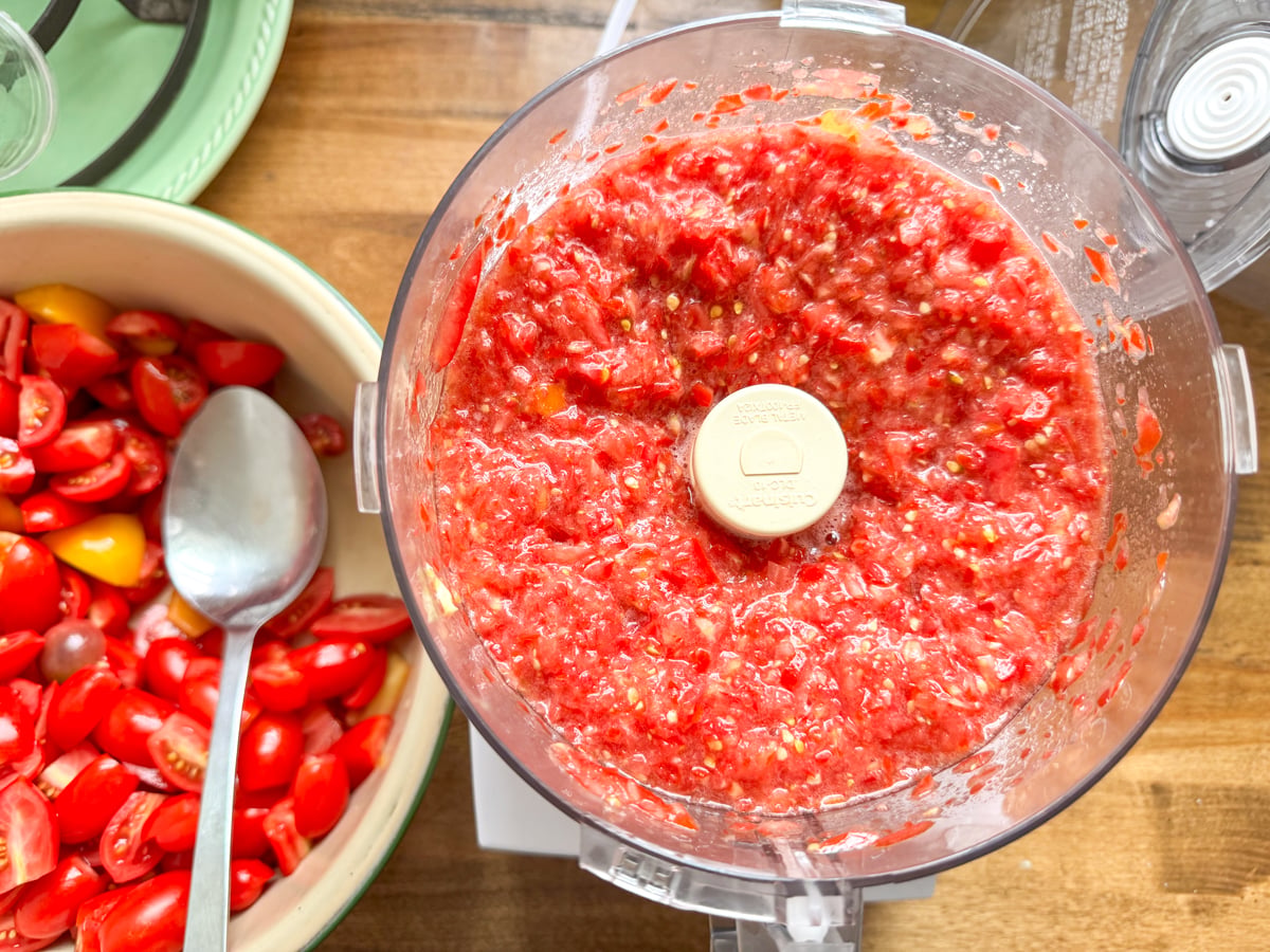 chopping small tomatoes in food processor